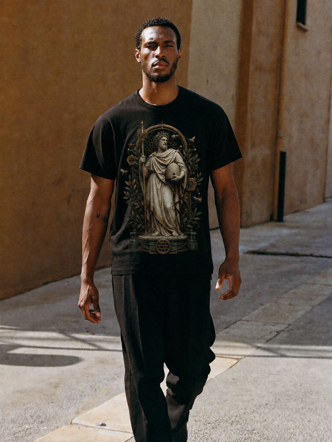 Aristaeus Hive Order black T-shirt — male Athens lifestyle shot 01