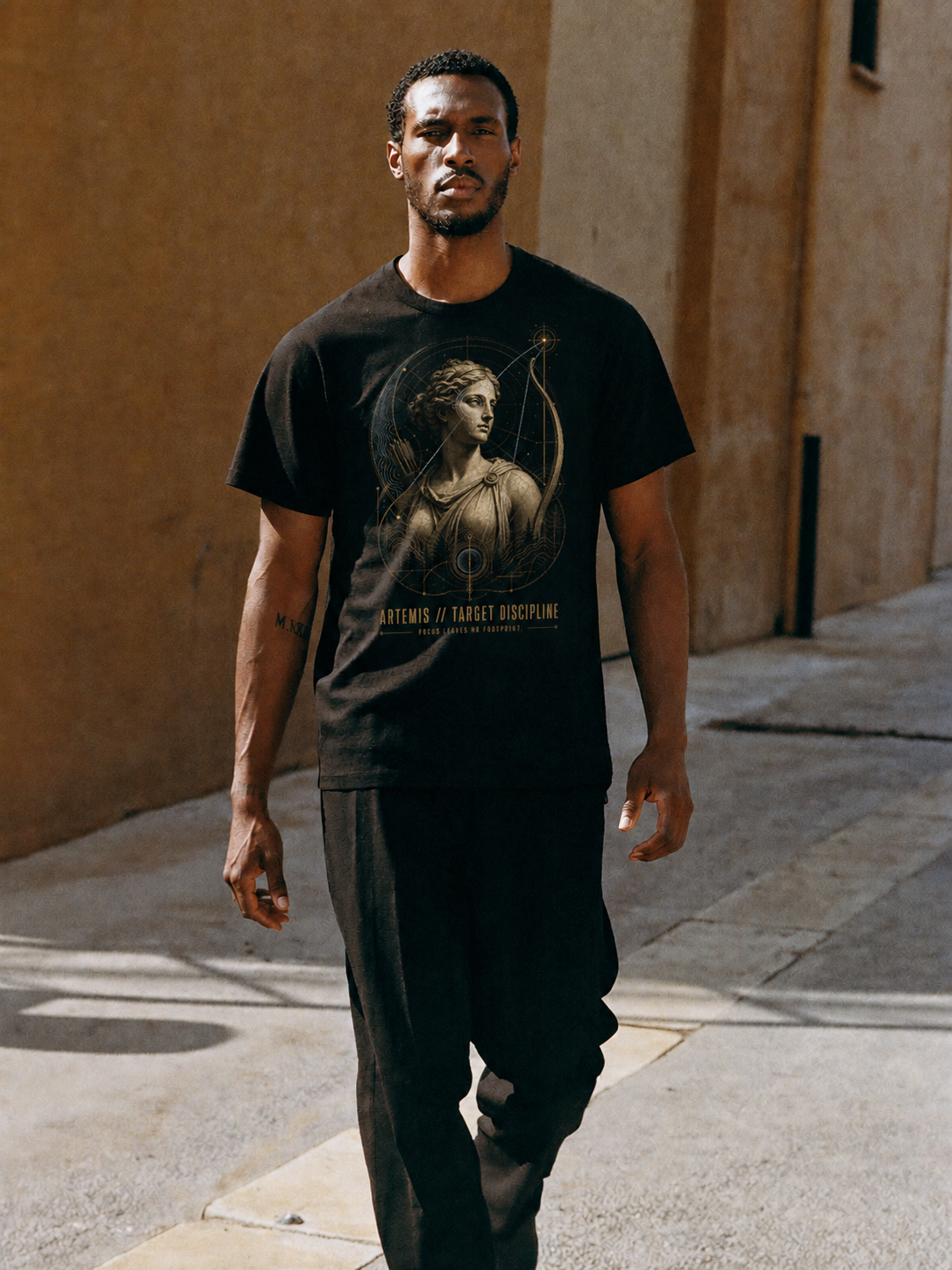Artemis Target Discipline black T-shirt — male Athens lifestyle shot 01