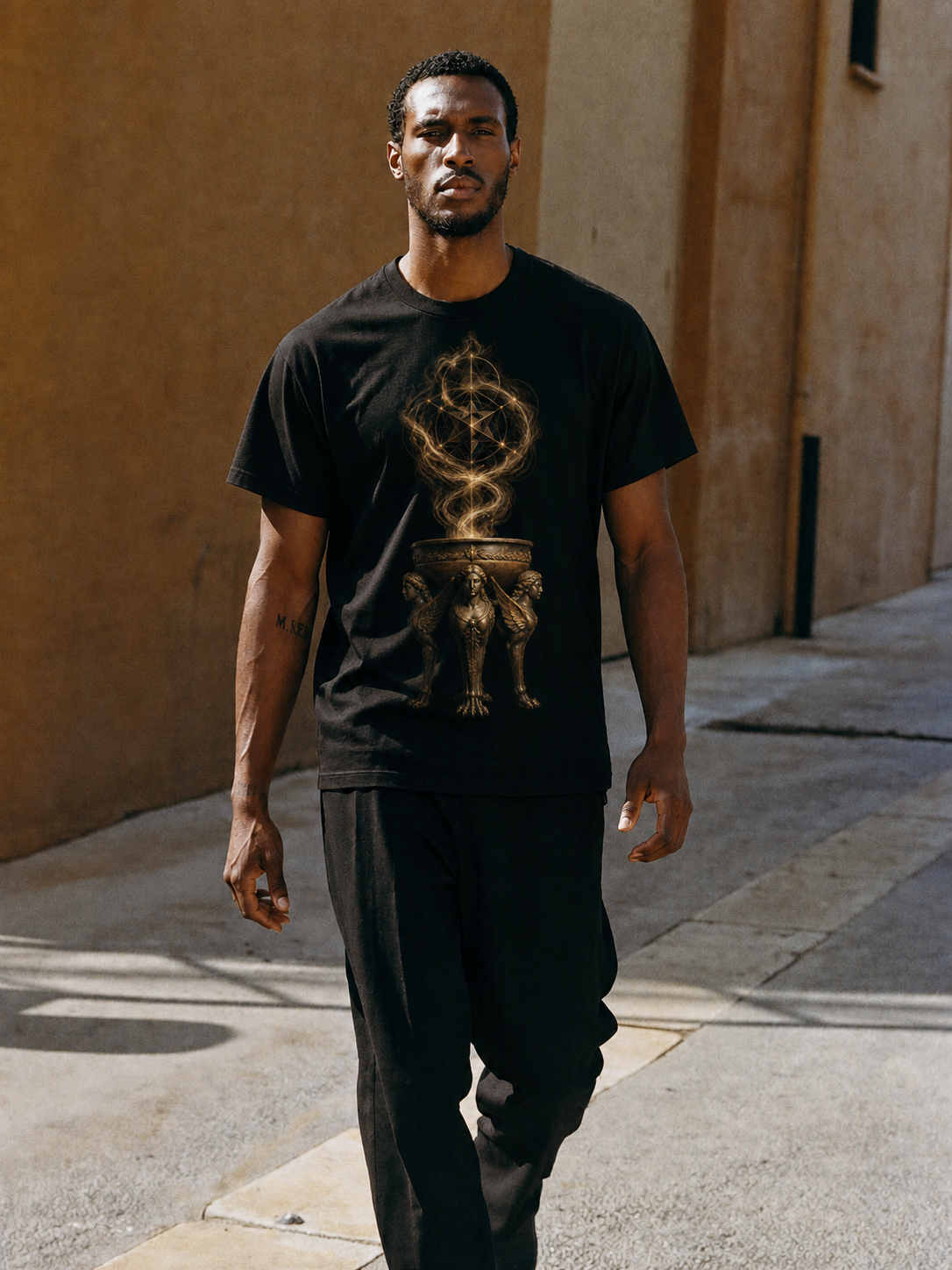 Delphic Tripod black T-shirt — male Athens lifestyle shot 01