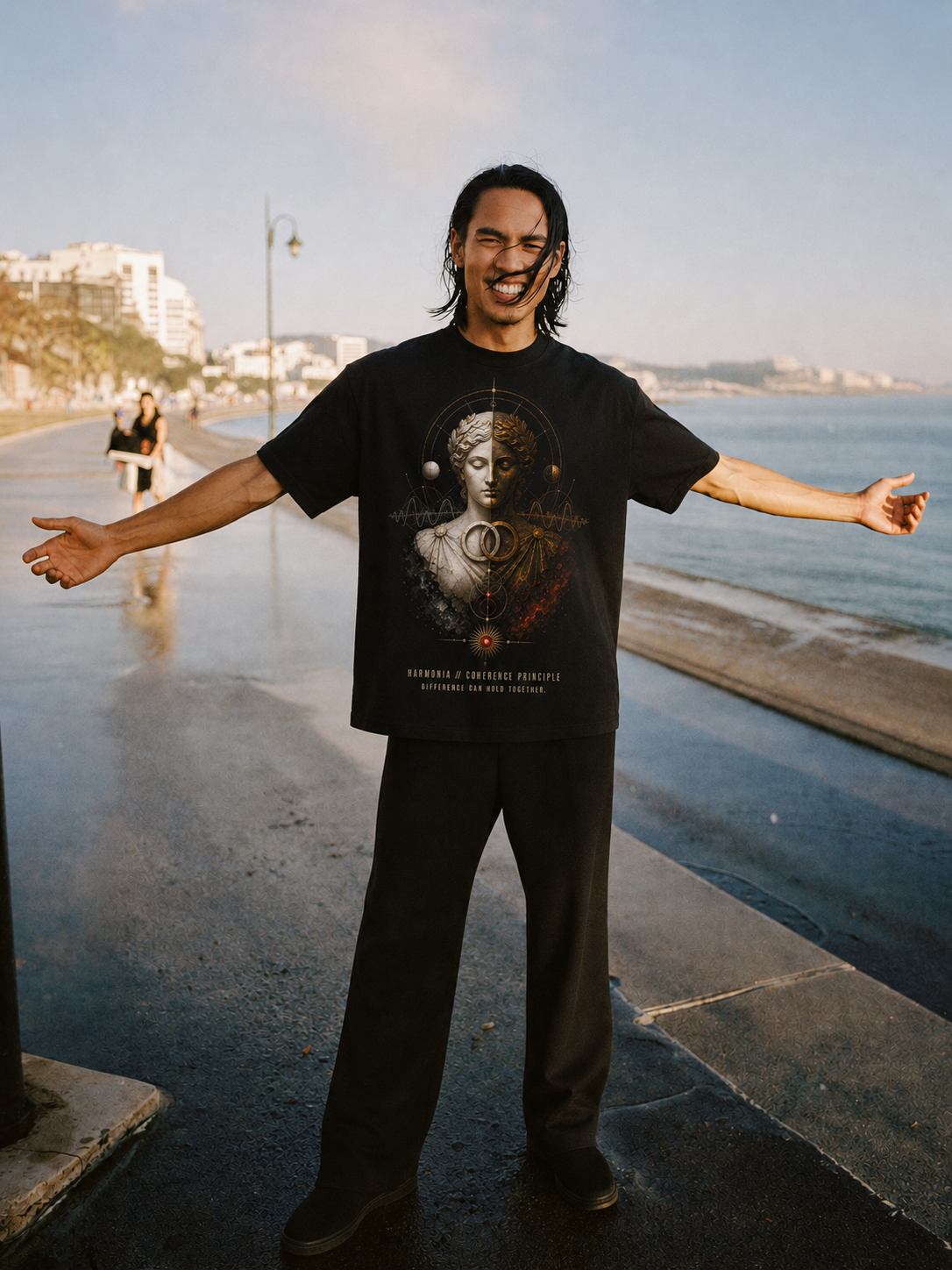 Harmonia Coherence Principle black T-shirt — male Athens lifestyle shot 01