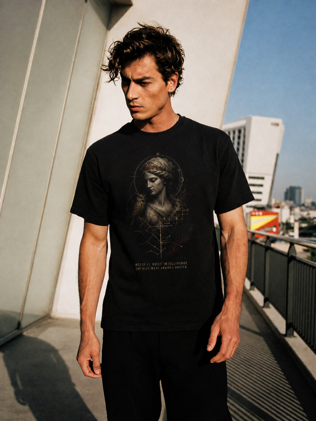 Metis Quiet Intelligence black T-shirt — male Athens lifestyle shot 01