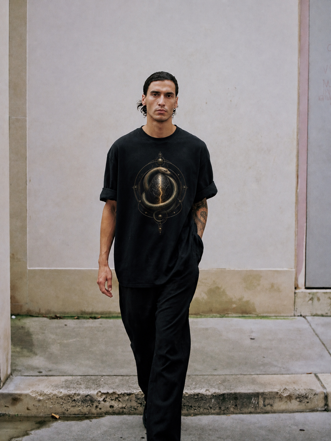 Orphic Cosmic Egg black T-shirt — male Athens lifestyle shot 01