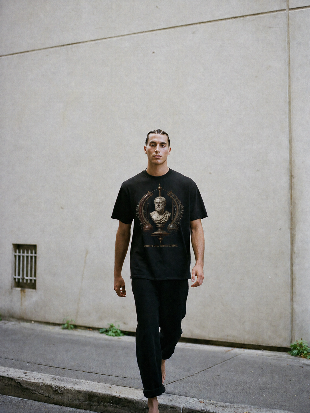 Aristotle Golden Mean black T-shirt — male Athens lifestyle shot 02