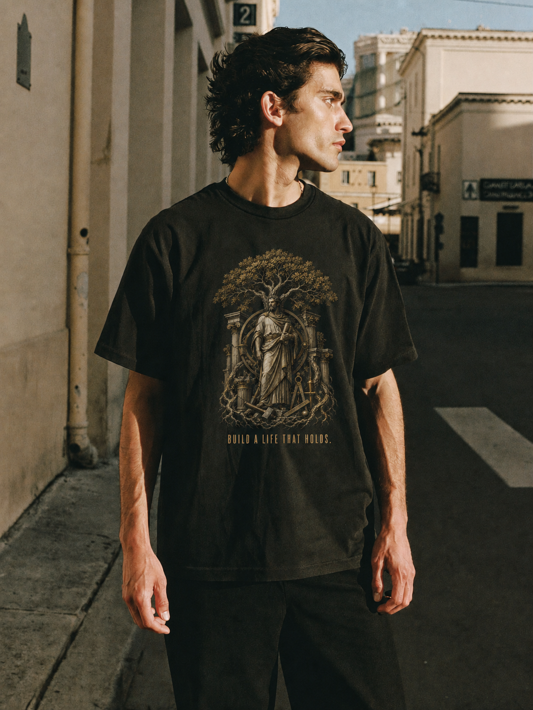 Eudaimonia Human Flourishing black T-shirt — male Athens lifestyle shot 02