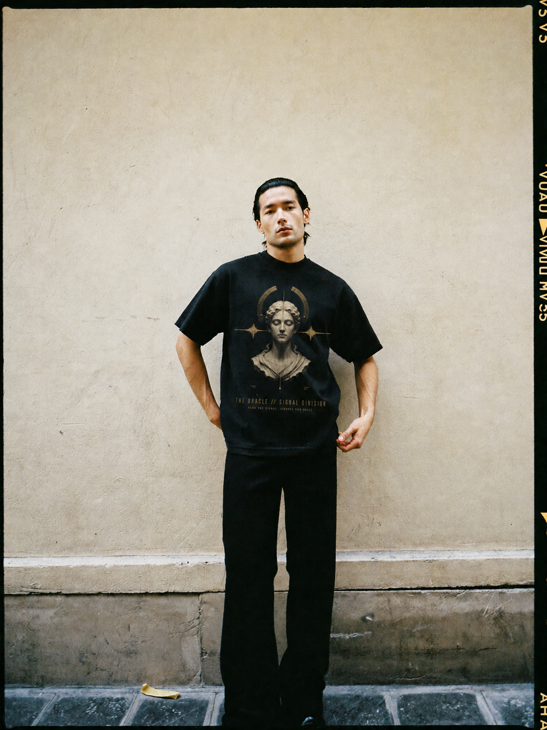 The Oracle Signal Division black T-shirt — male Athens lifestyle view 2