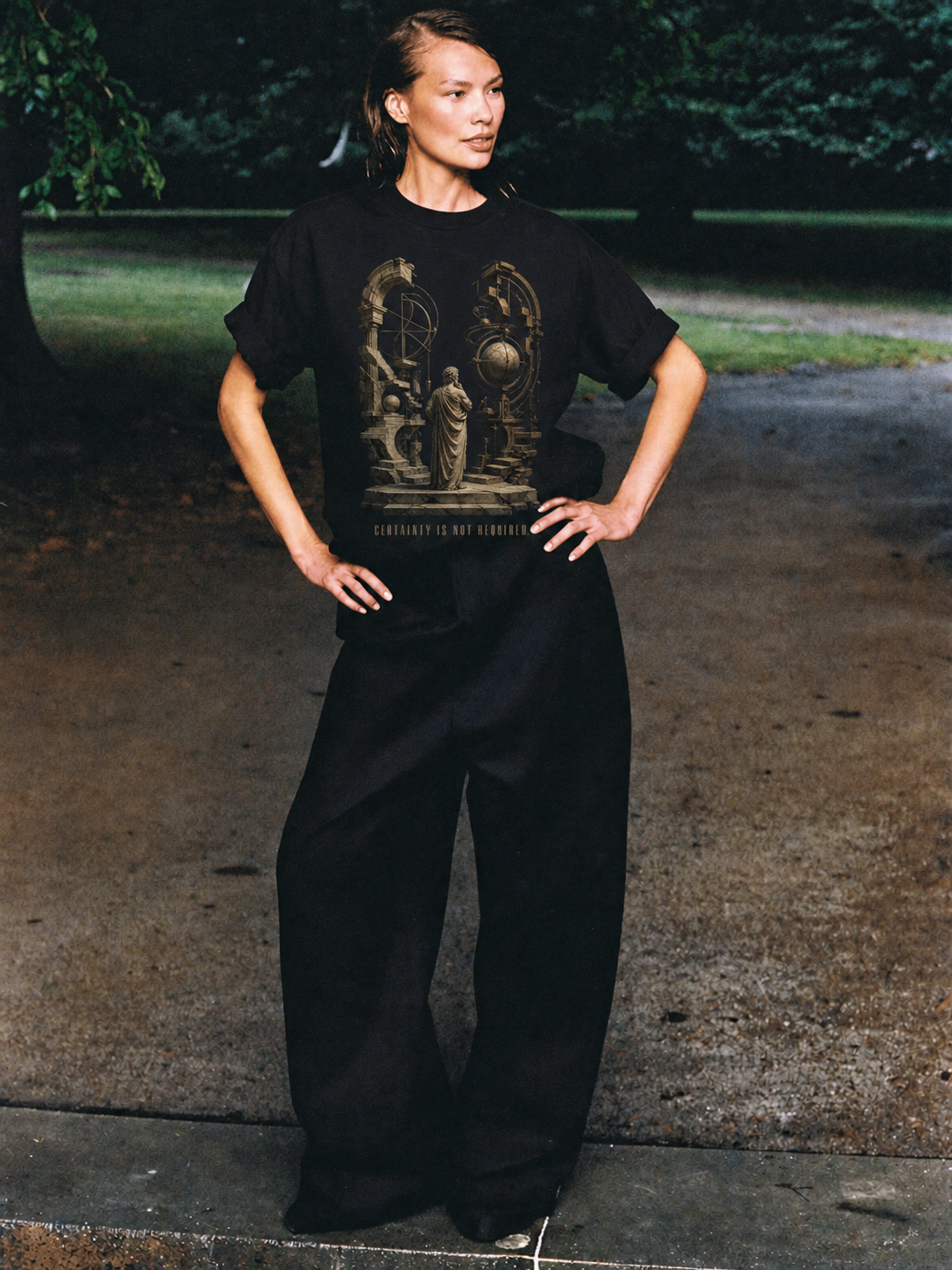 Arcesilaus Open Inquiry black T-shirt — female Athens lifestyle shot 03