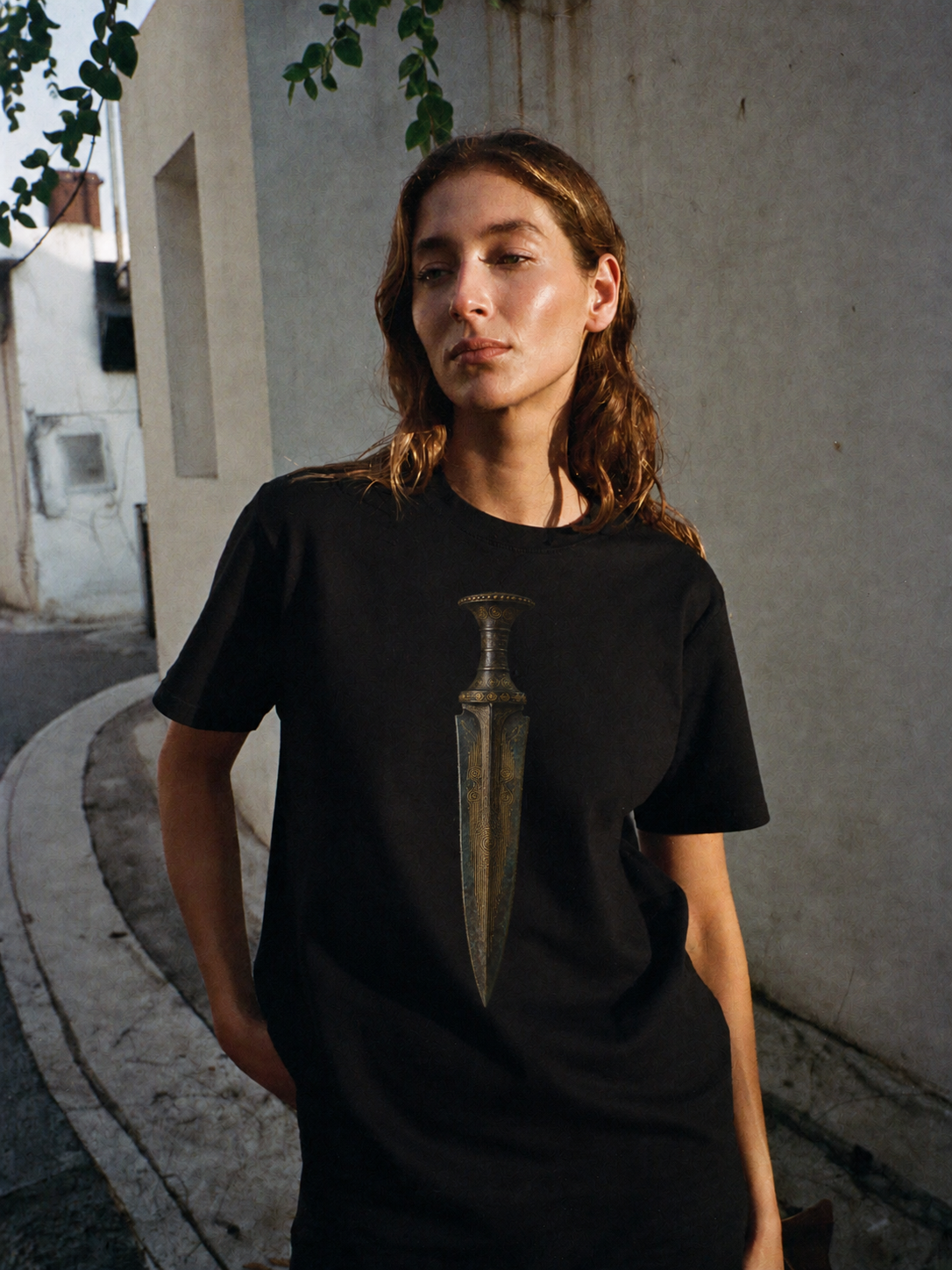 Mycenaean Gold-Weave Blade T-Shirt — female lifestyle scene 1 in Athens