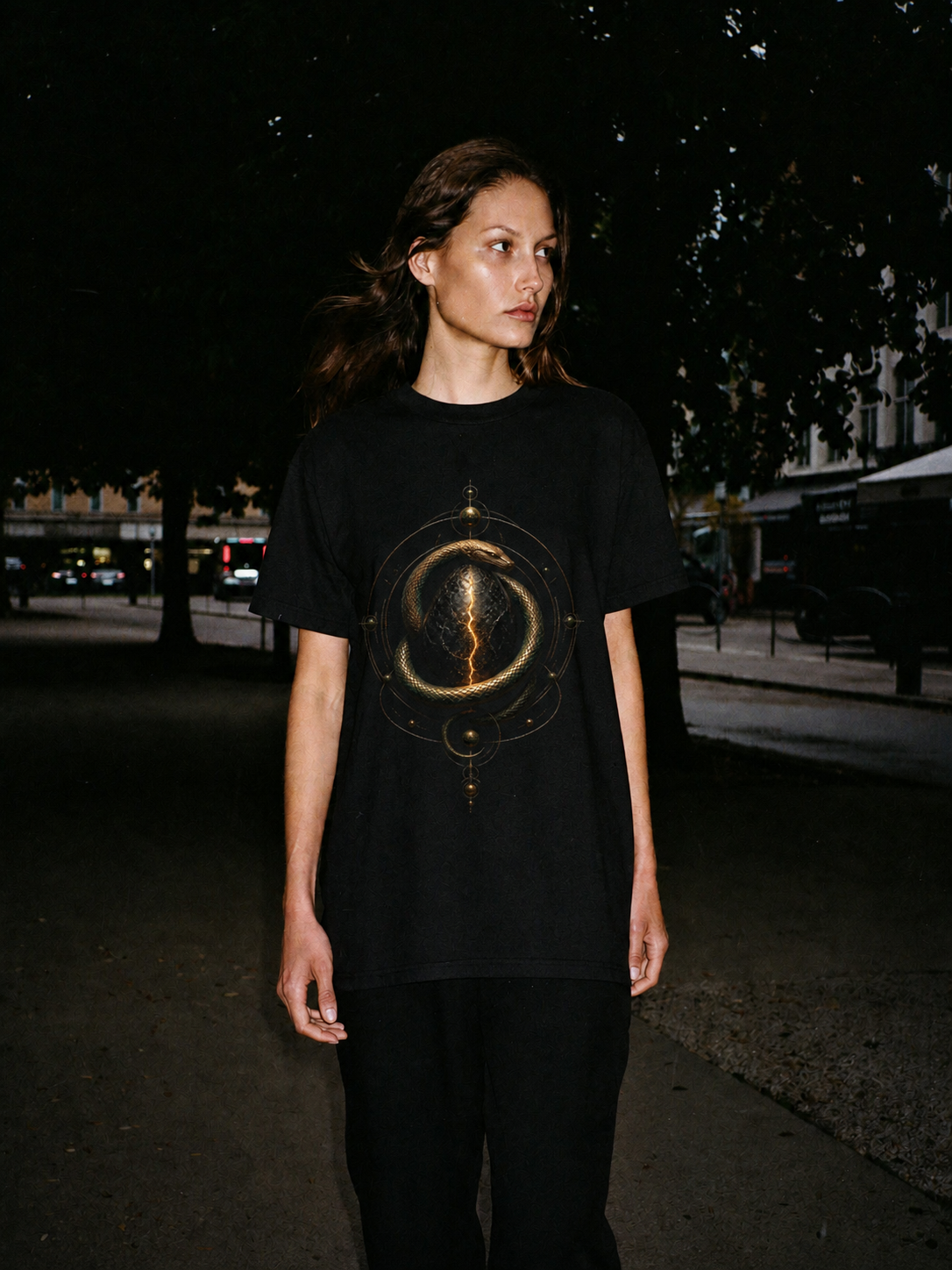 Orphic Cosmic Egg black T-shirt — female Athens lifestyle shot 03