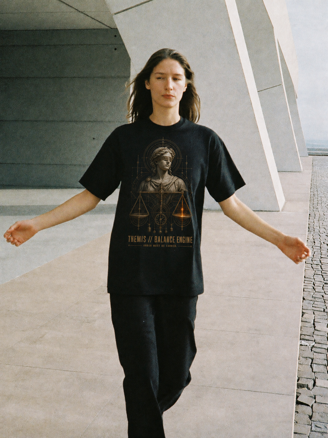 Themis Balance Engine black T-shirt — female Athens lifestyle shot 03