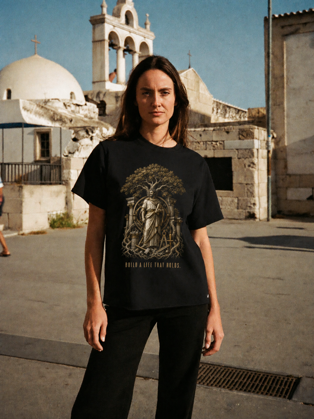 Eudaimonia Human Flourishing black T-shirt — female Athens lifestyle shot 04