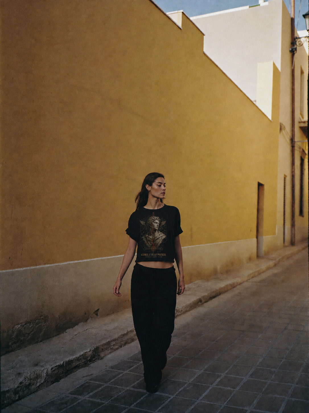 Hermes Relay Protocol black T-shirt — female Athens lifestyle shot 04