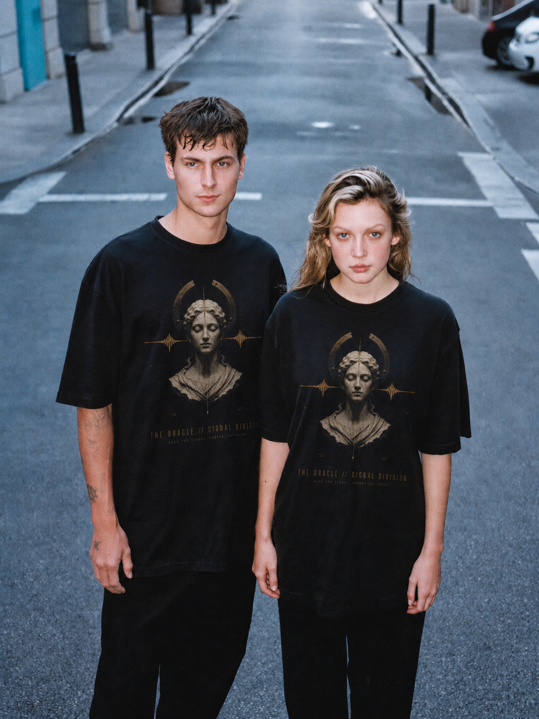 The Oracle Signal Division black T-shirt — couple Athens lifestyle view 1