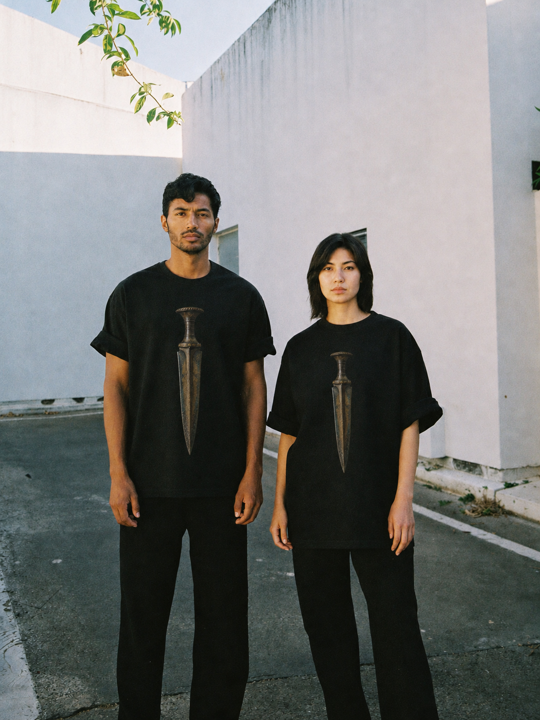 Mycenaean Gold-Weave Blade T-Shirt — couple lifestyle scene 1 in Athens