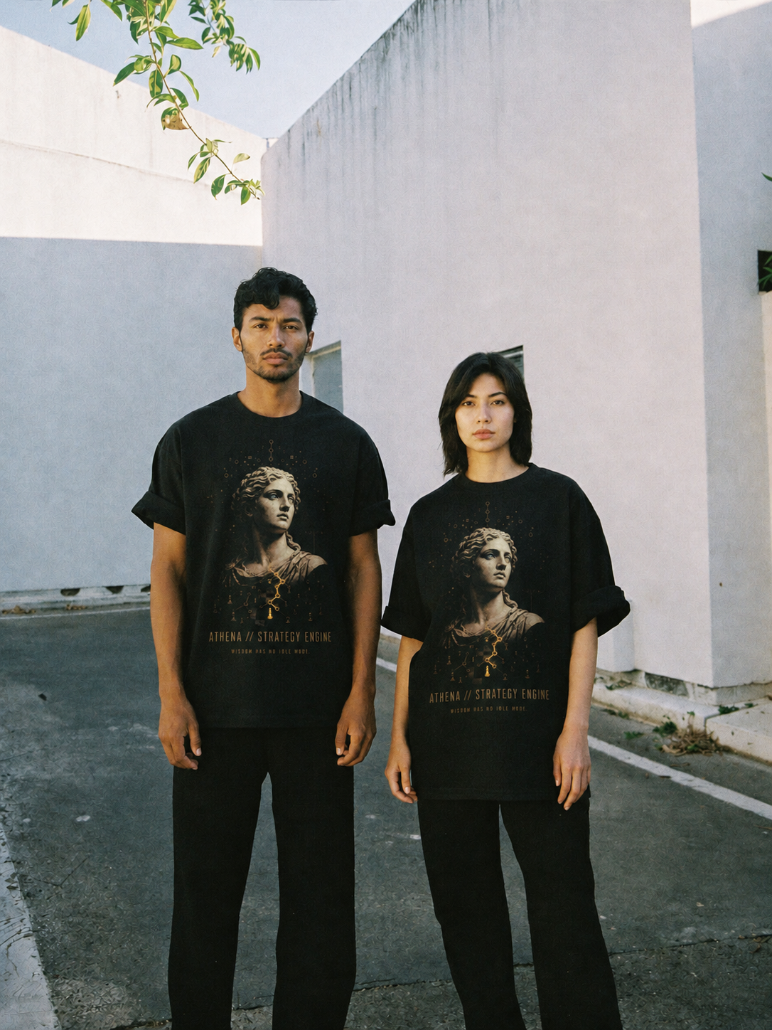 Athena Strategy Engine black T-shirt — couple Athens lifestyle view 2