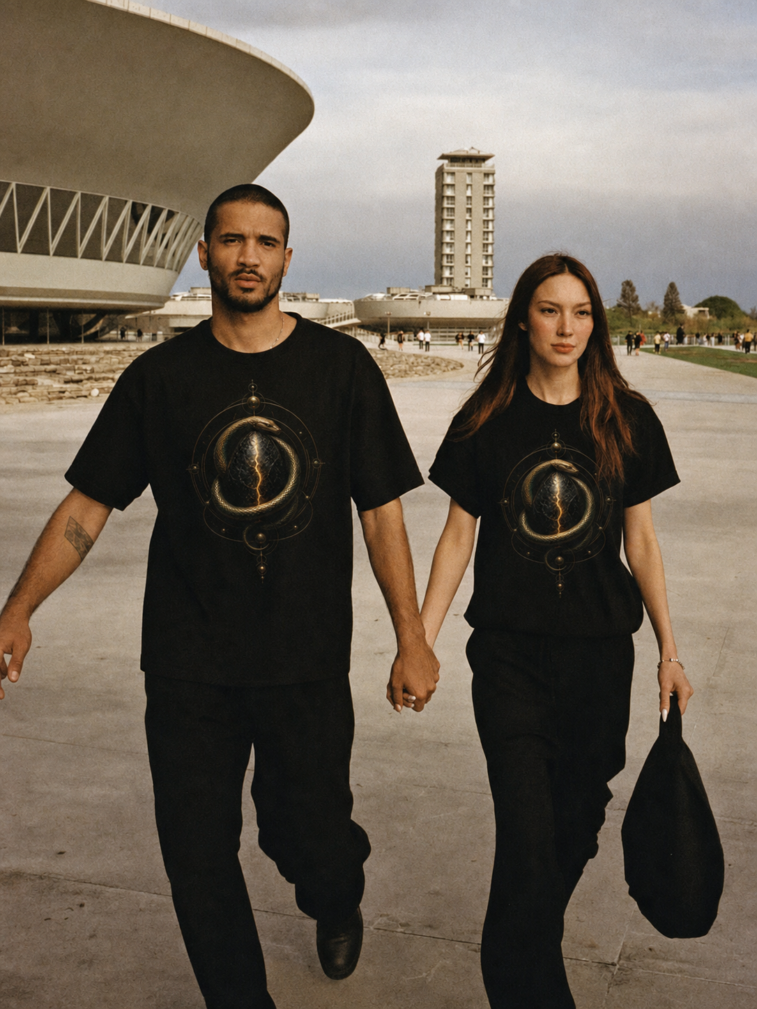 Orphic Cosmic Egg black T-shirt — couple Athens lifestyle shot 06